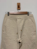 Load image into Gallery viewer, Louis Vuitton monogram embossed cream jogging trousers - S
