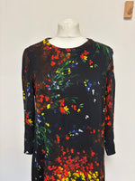 Load image into Gallery viewer, Colorful floral dress on a mannequin against a white background
